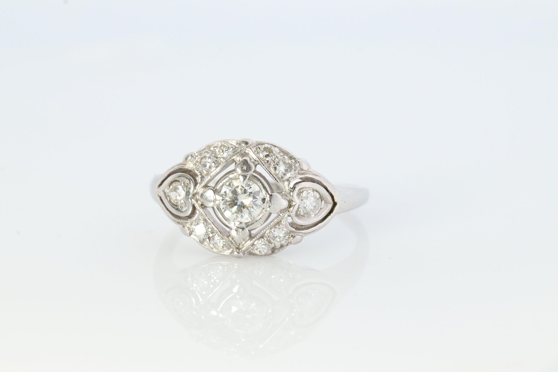 14k Art Deco Shield ring 14k white gold with diamonds and filigree open design.