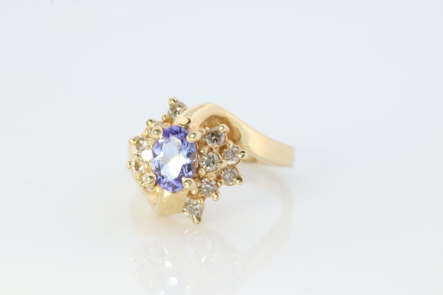 Tanzanite and diamond Cluster ring. 14k Blue Tanzanite and Diamond Halo Bypass