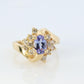 Tanzanite and diamond Cluster ring. 14k Blue Tanzanite and Diamond Halo Bypass