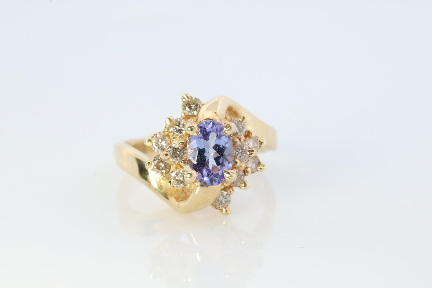 Tanzanite and diamond Cluster ring. 14k Blue Tanzanite and Diamond Halo Bypass