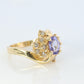 Tanzanite and diamond Cluster ring. 14k Blue Tanzanite and Diamond Halo Bypass