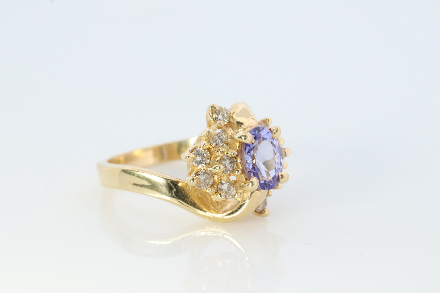 Tanzanite and diamond Cluster ring. 14k Blue Tanzanite and Diamond Halo Bypass