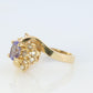 Tanzanite and diamond Cluster ring. 14k Blue Tanzanite and Diamond Halo Bypass