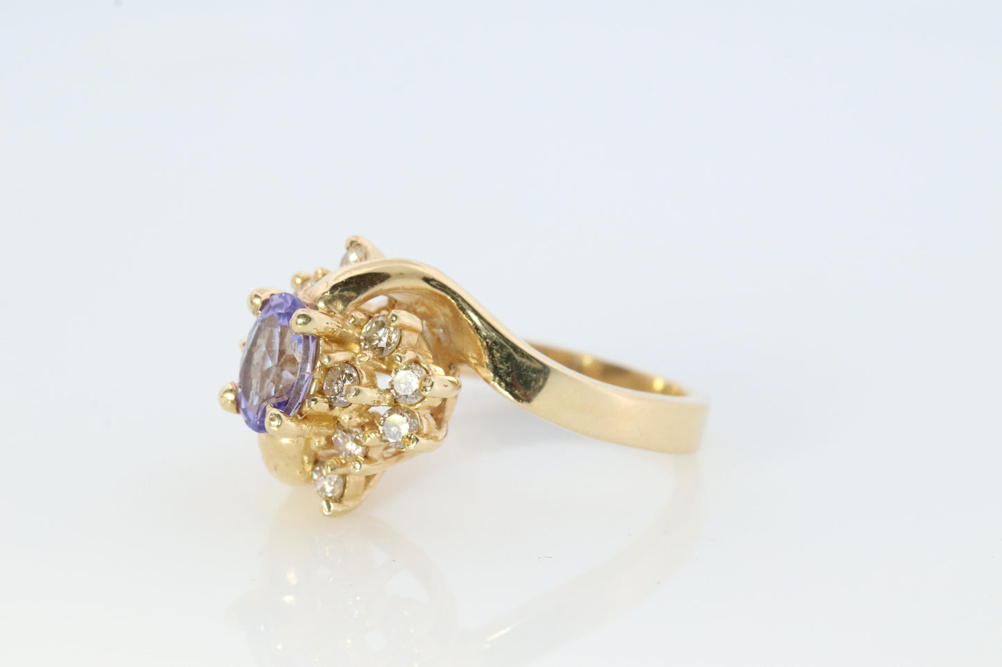 Tanzanite and diamond Cluster ring. 14k Blue Tanzanite and Diamond Halo Bypass