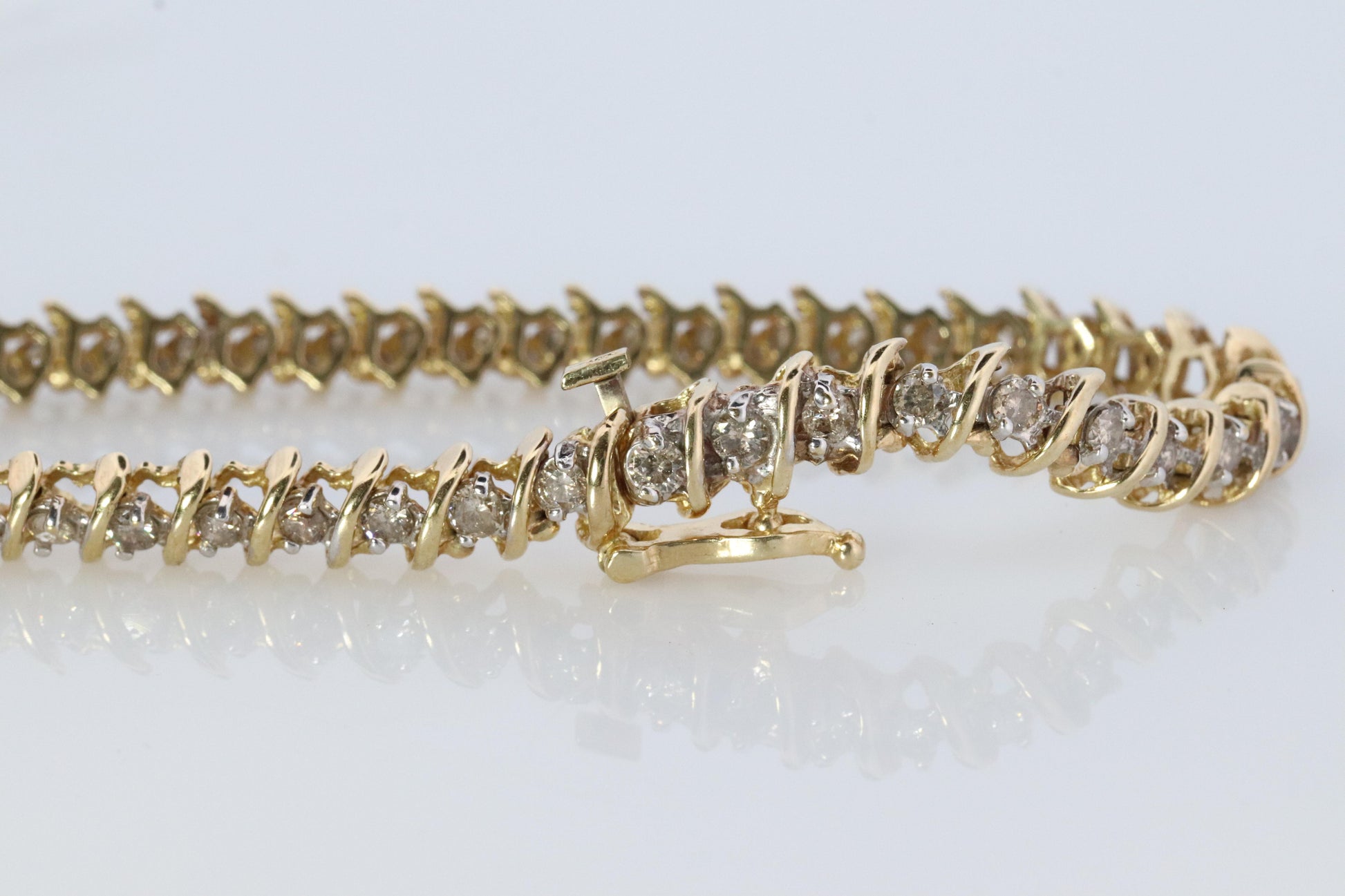 10k Diamond Tennis Bracelet. 10k S-LINK round diamond Tennis bracelet. 2.5CTW