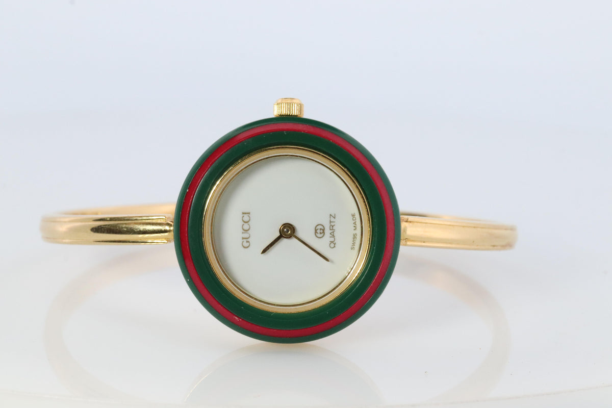Gucci Gold Women\'s Interchangeable Bezel Bangle Watch with Colorful Bezels Distinctive Gucci vintage watch from the 1990s featuring the  main image 2