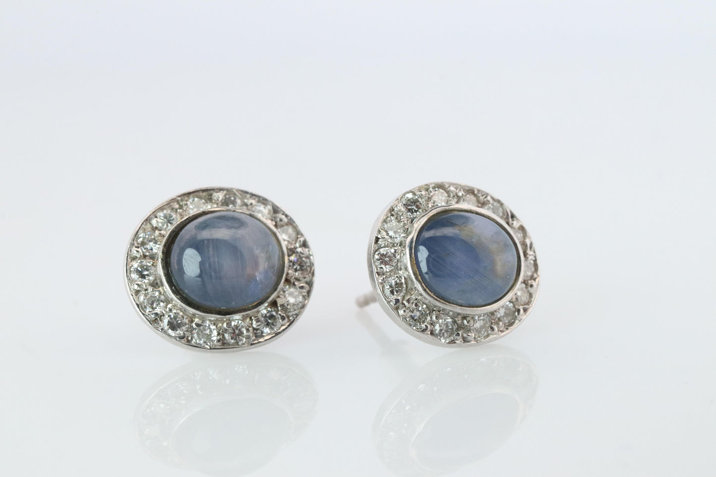Star Sapphire Stud Earrings. Platinum PT900 Star Saphire Halo Diamond earrings.