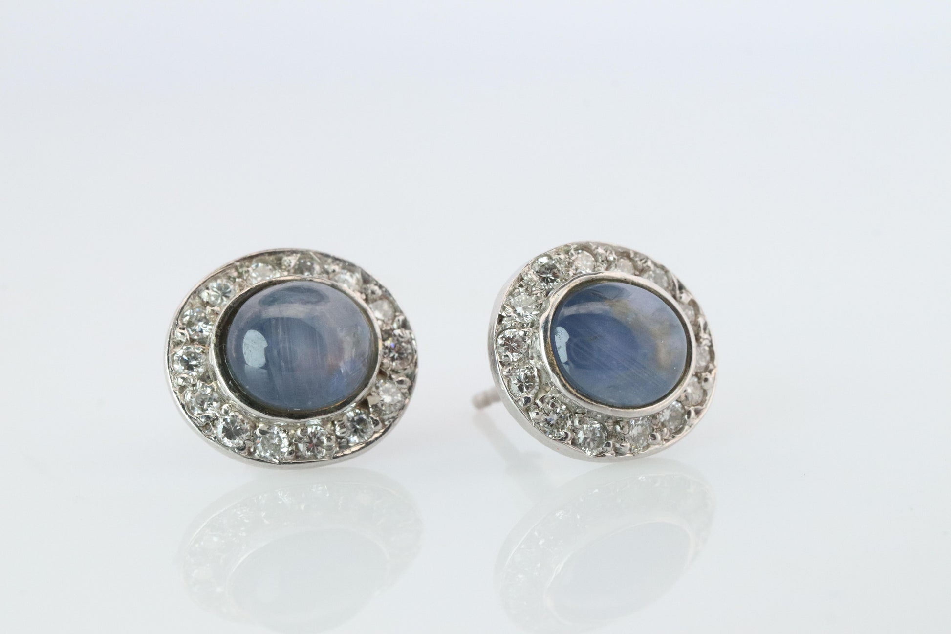 Star Sapphire Stud Earrings. Platinum PT900 Star Saphire Halo Diamond earrings.