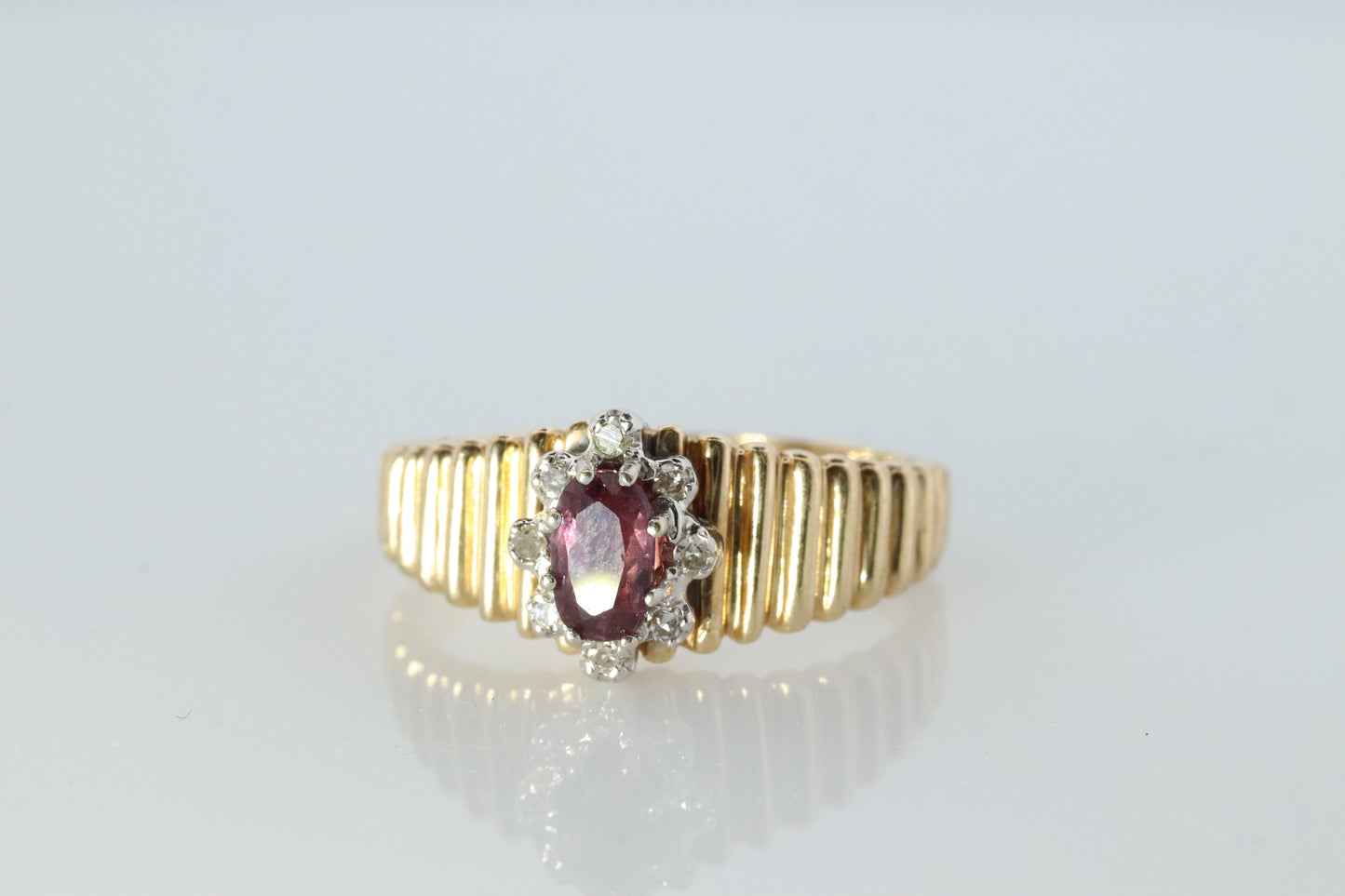 10k Ruby and Diamond HALO ring. 10k Yellow Gold Ribbed shank Ruby Halo ring.