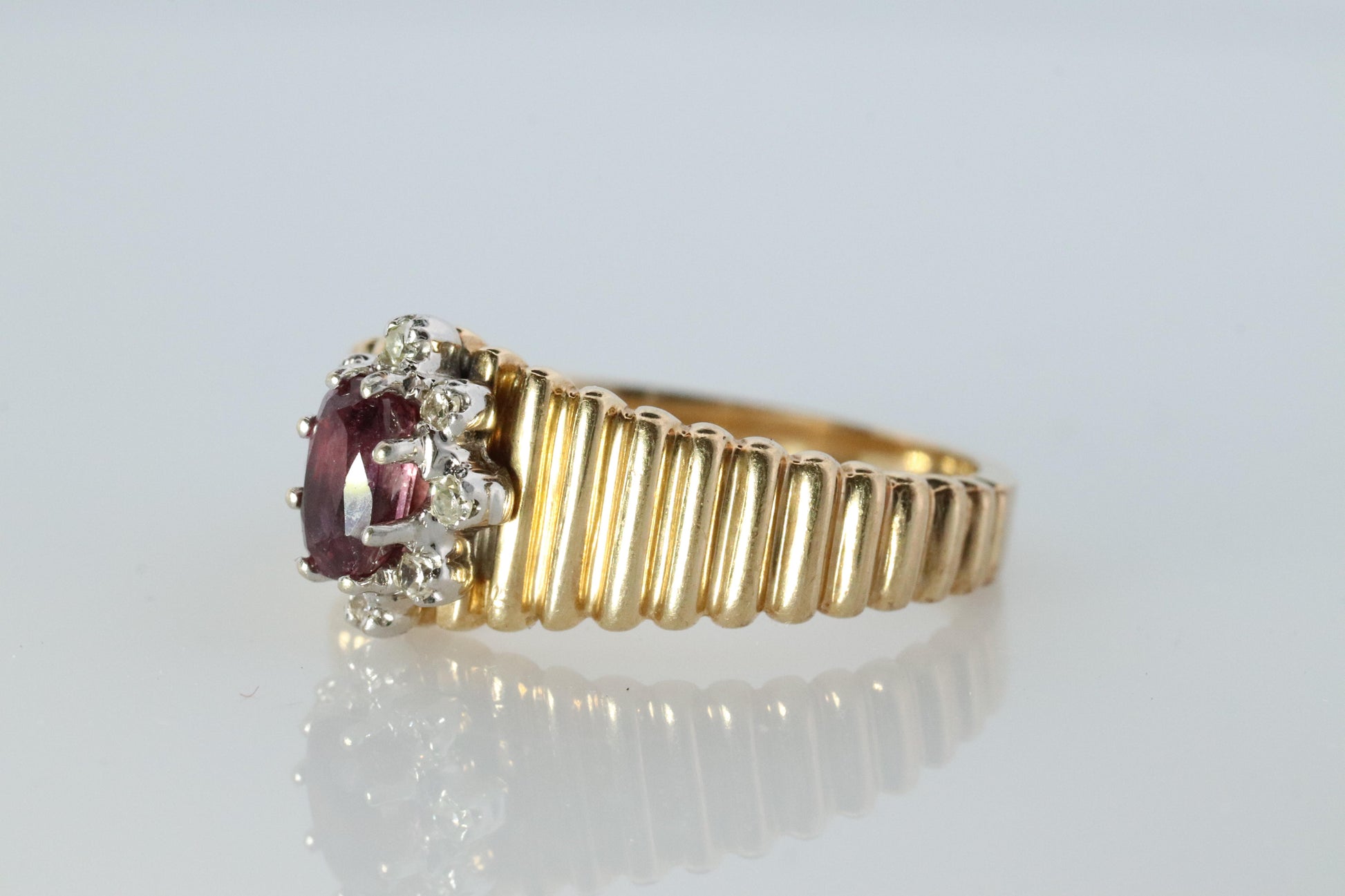 10k Ruby and Diamond HALO ring. 10k Yellow Gold Ribbed shank Ruby Halo ring.