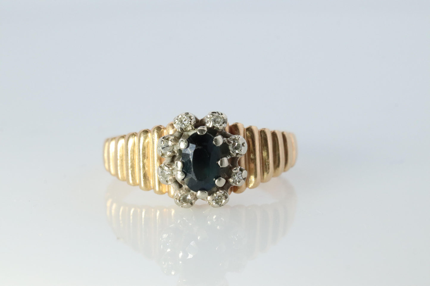 10k Sapphire and diamond Halo ring. 10k Blue sapphire and diamond ribbed band.