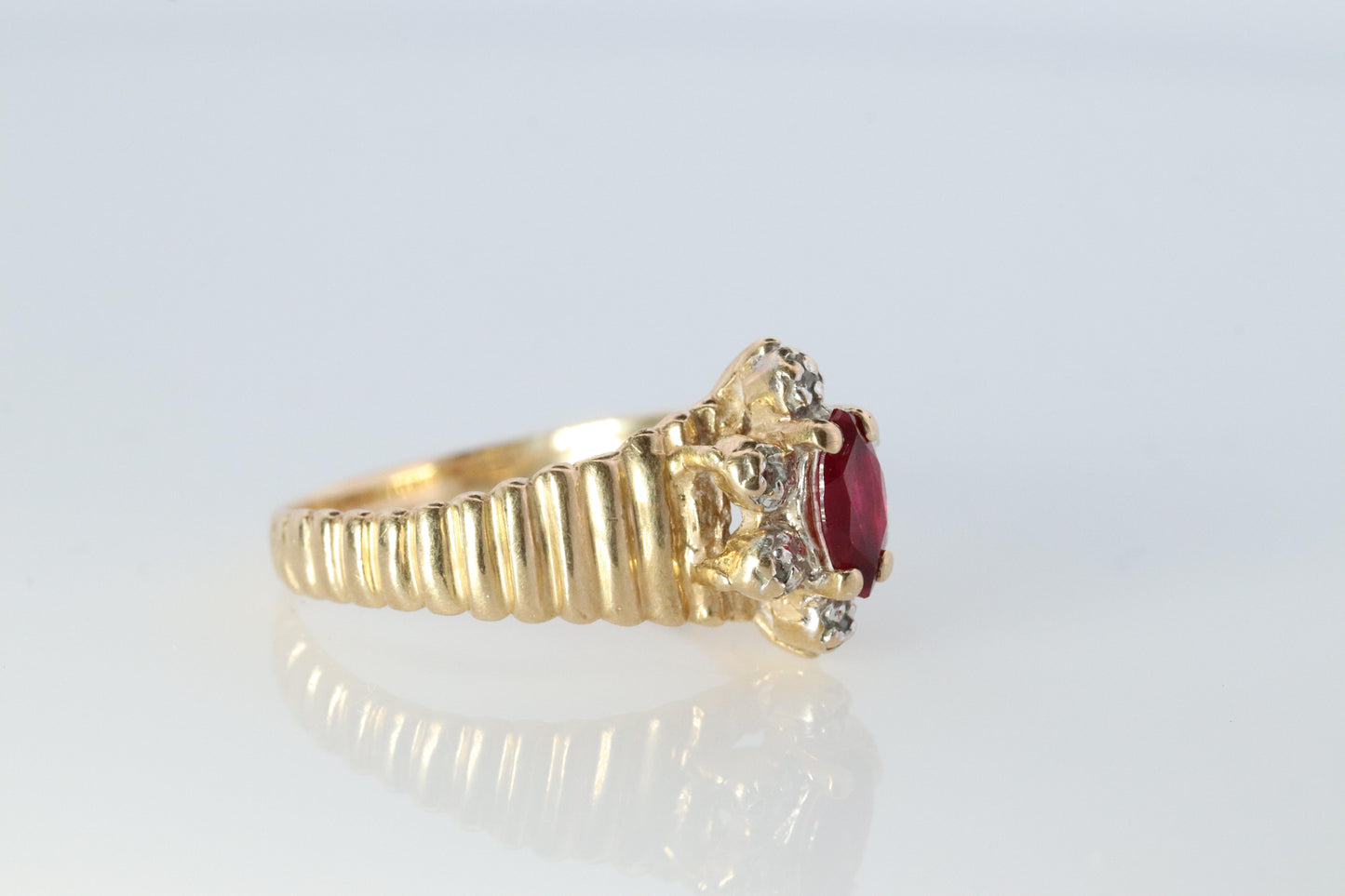 10k Ruby and Diamond HALO ring. 10k Yellow Gold Ribbed shank Ruby Halo ring.