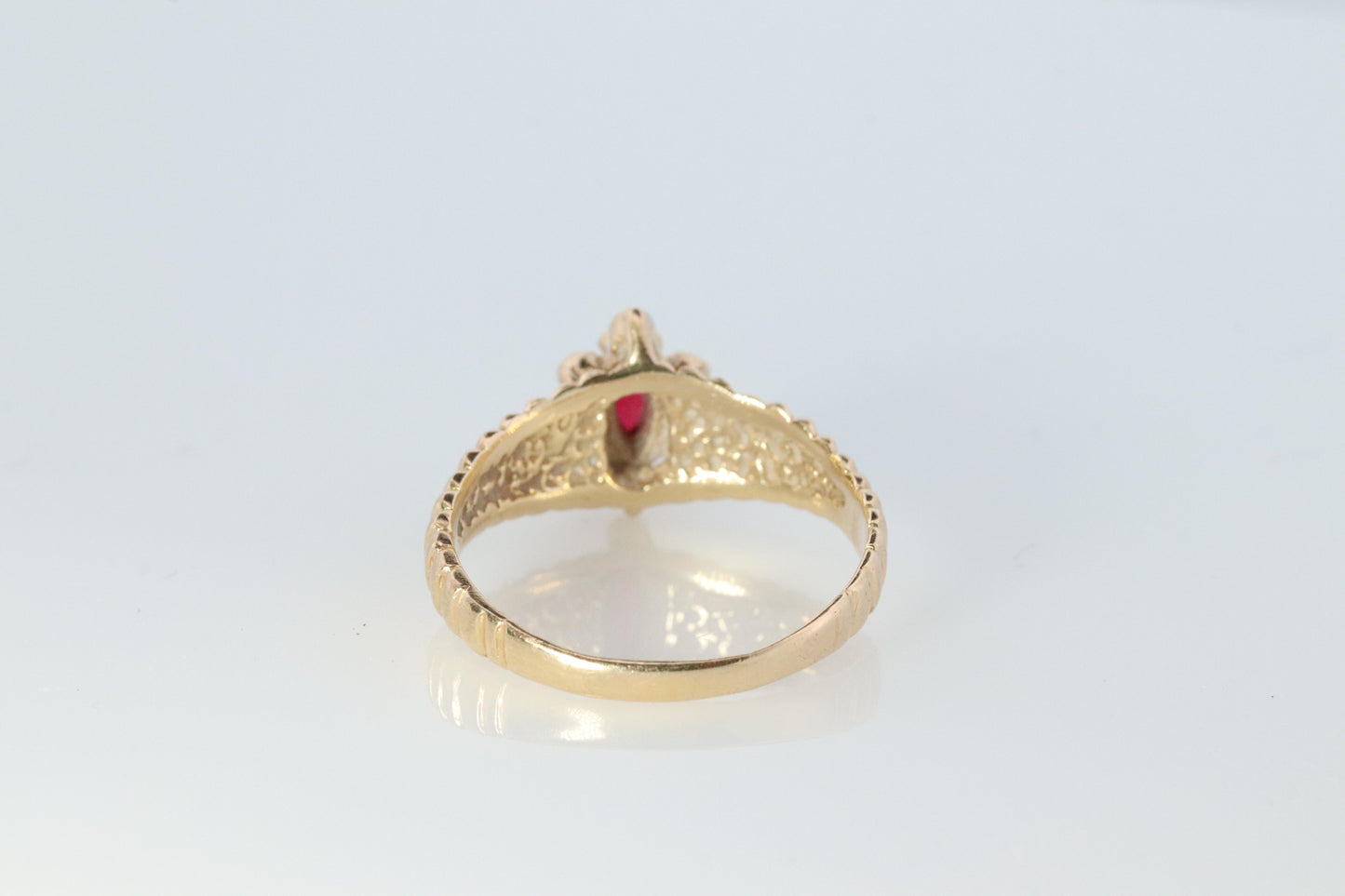 10k Ruby and Diamond HALO ring. 10k Yellow Gold Ribbed shank Ruby Halo ring.