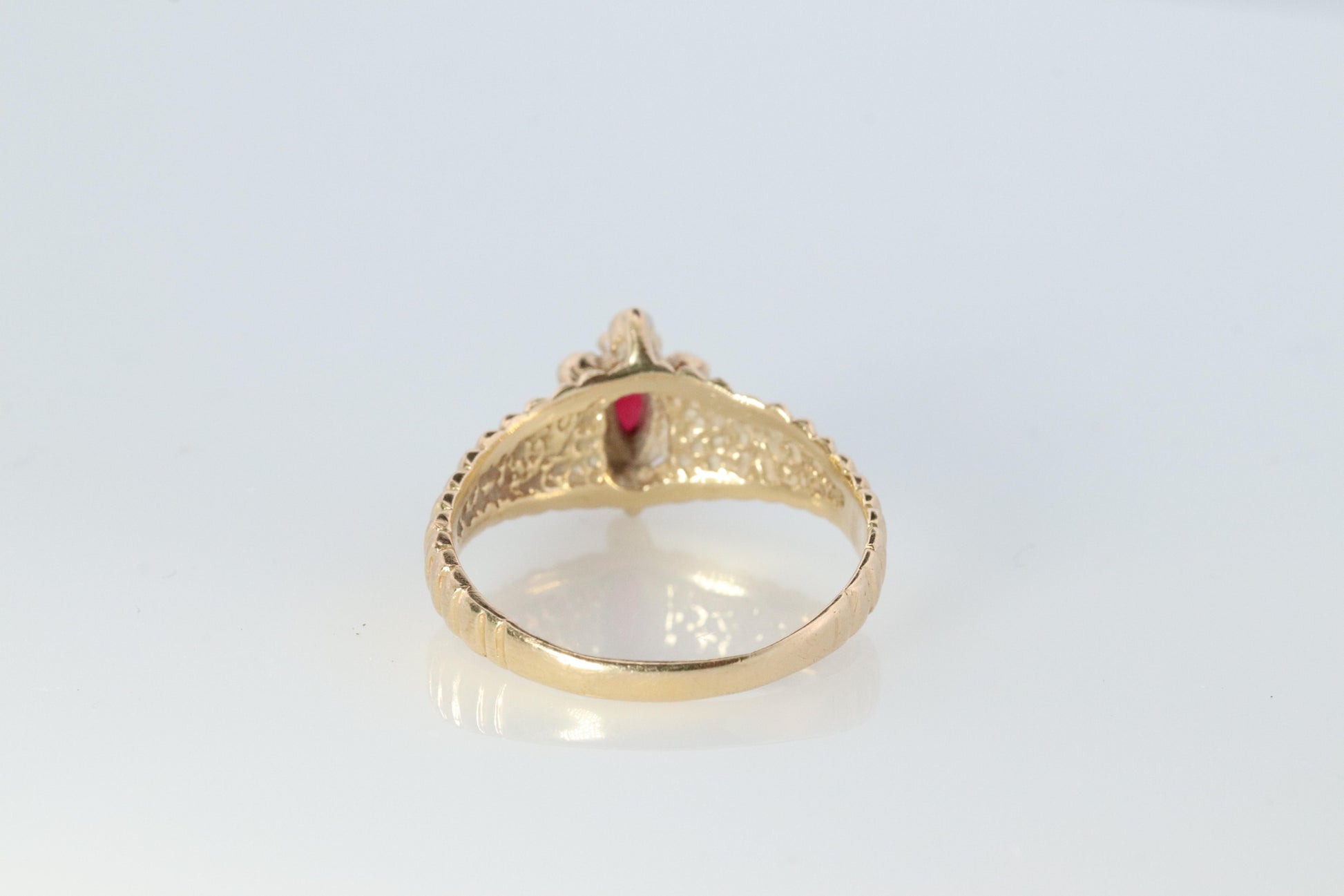 10k Ruby and Diamond HALO ring. 10k Yellow Gold Ribbed shank Ruby Halo ring.