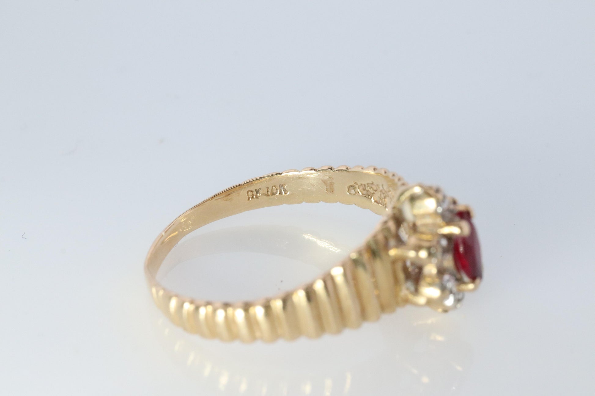 10k Ruby and Diamond HALO ring. 10k Yellow Gold Ribbed shank Ruby Halo ring.