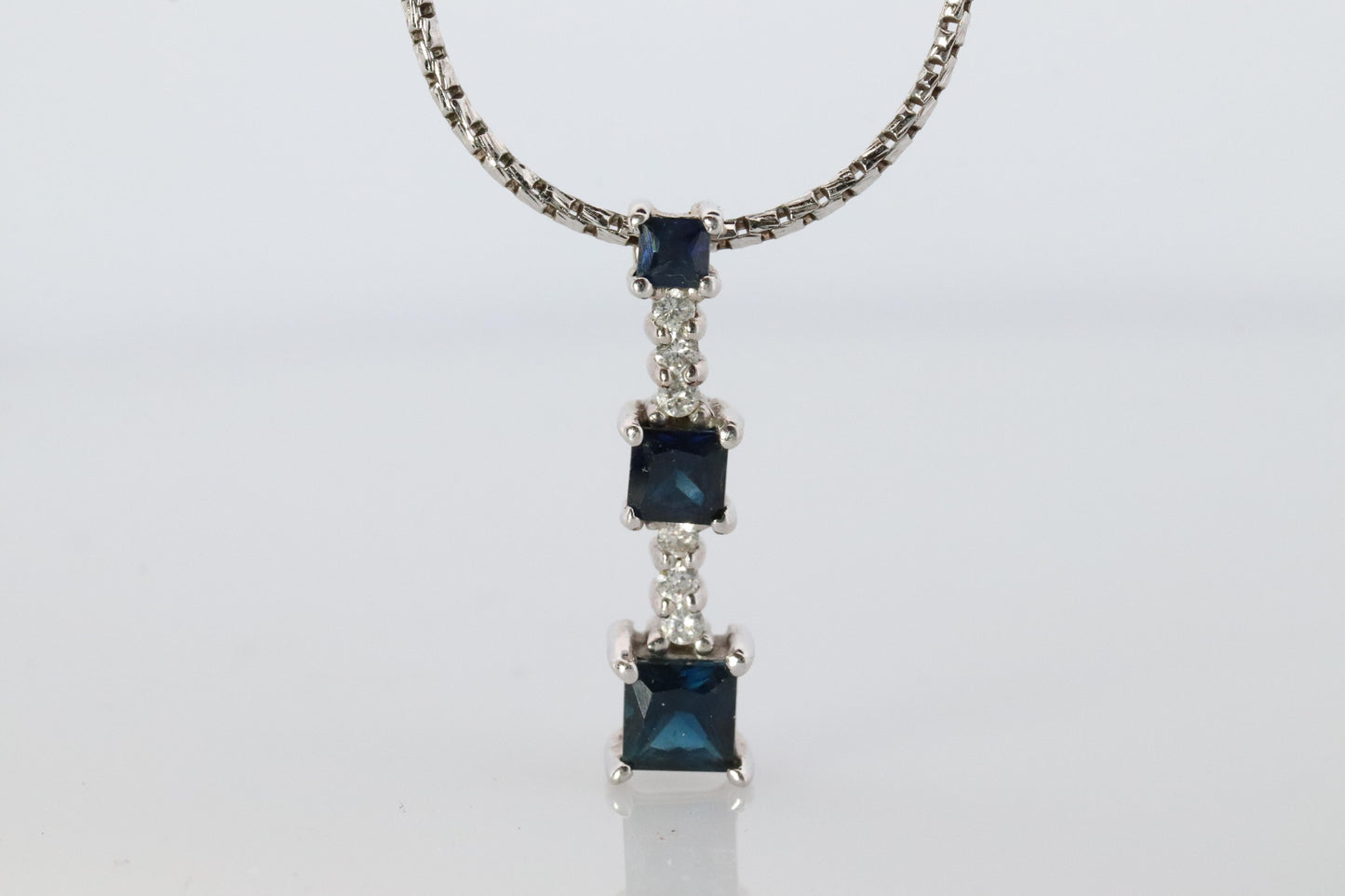 Blue Sapphire diamond Journey pendant. 14k Gold Princess Sapphires Necklace