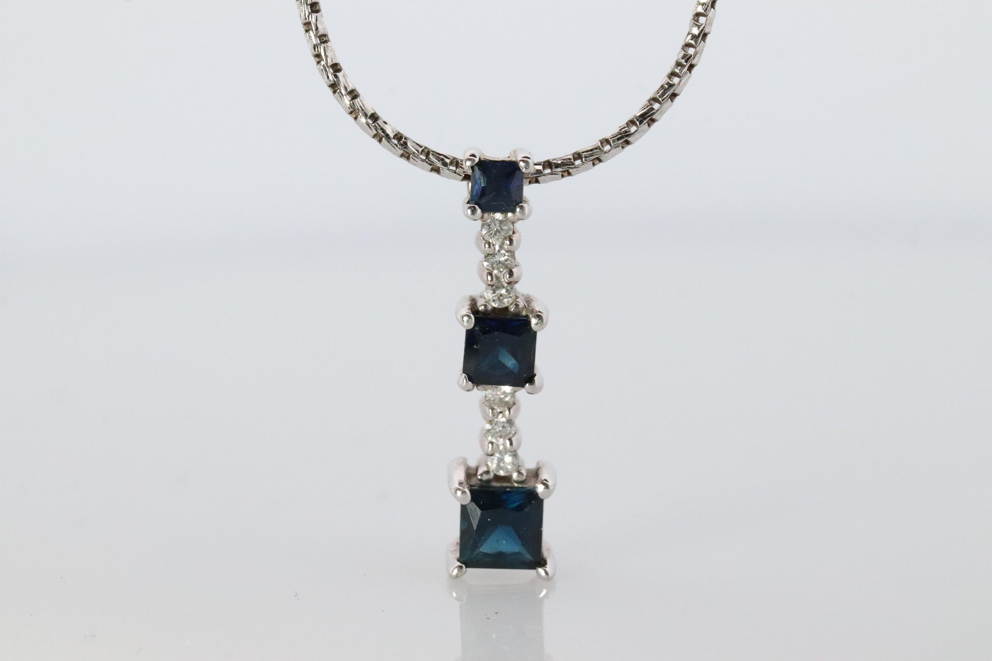 Blue Sapphire diamond Journey pendant. 14k Gold Princess Sapphires Necklace