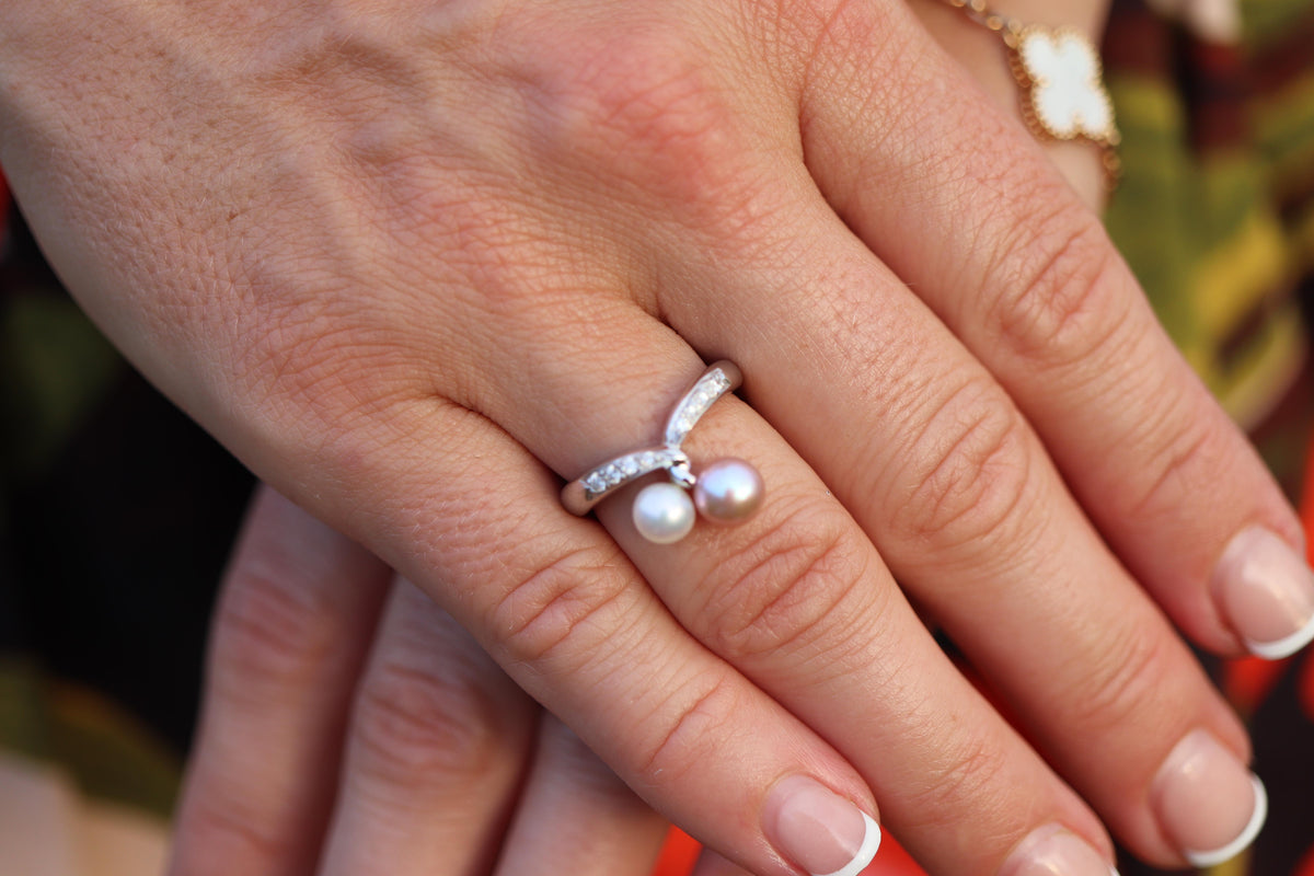 Mikimoto Ring. 18k Gold Mikimoto Pearl and Diamond Cluster. Twin pearl love knot
