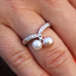 Mikimoto Ring. 18k Gold Mikimoto Pearl and Diamond Cluster. Twin pearl love knot
