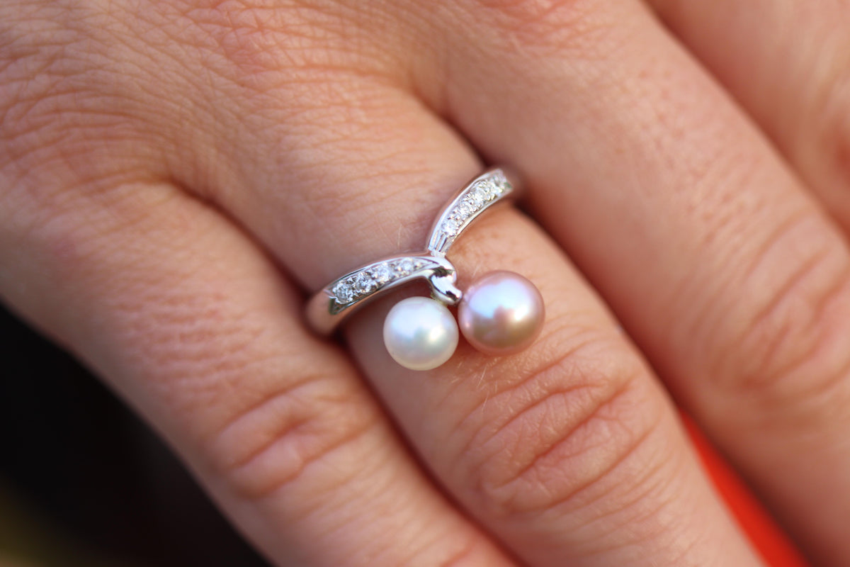 Mikimoto Ring. 18k Gold Mikimoto Pearl and Diamond Cluster. Twin pearl love knot