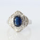 Sapphire and diamond Ballerina ring. Platinum Blue natural sapphire HALO ring