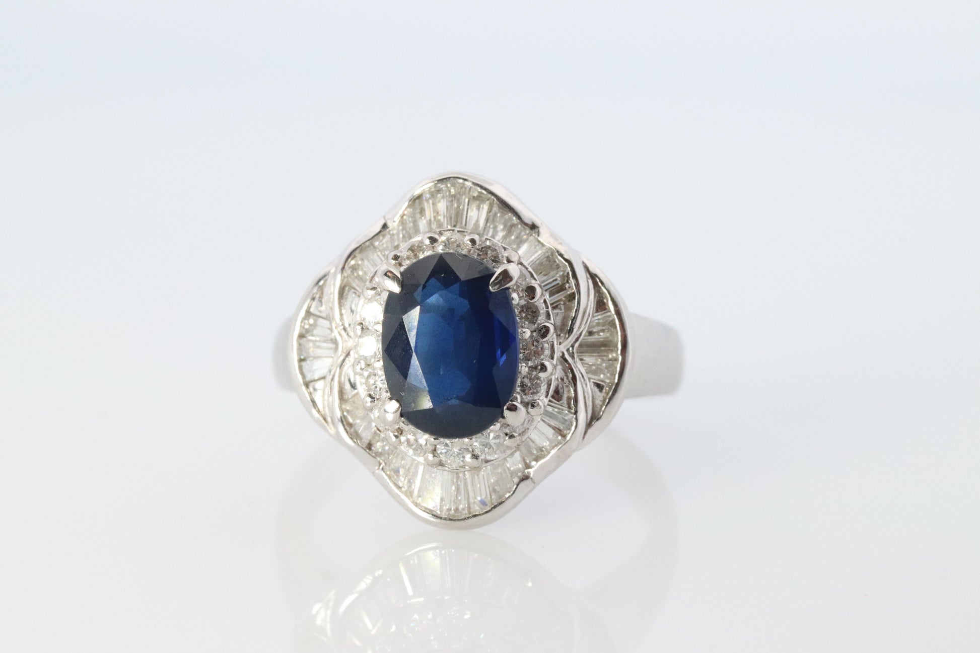Sapphire and diamond Ballerina ring. Platinum Blue natural sapphire HALO ring