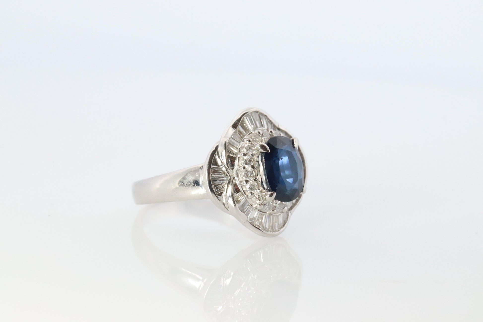 Sapphire and diamond Ballerina ring. Platinum Blue natural sapphire HALO ring