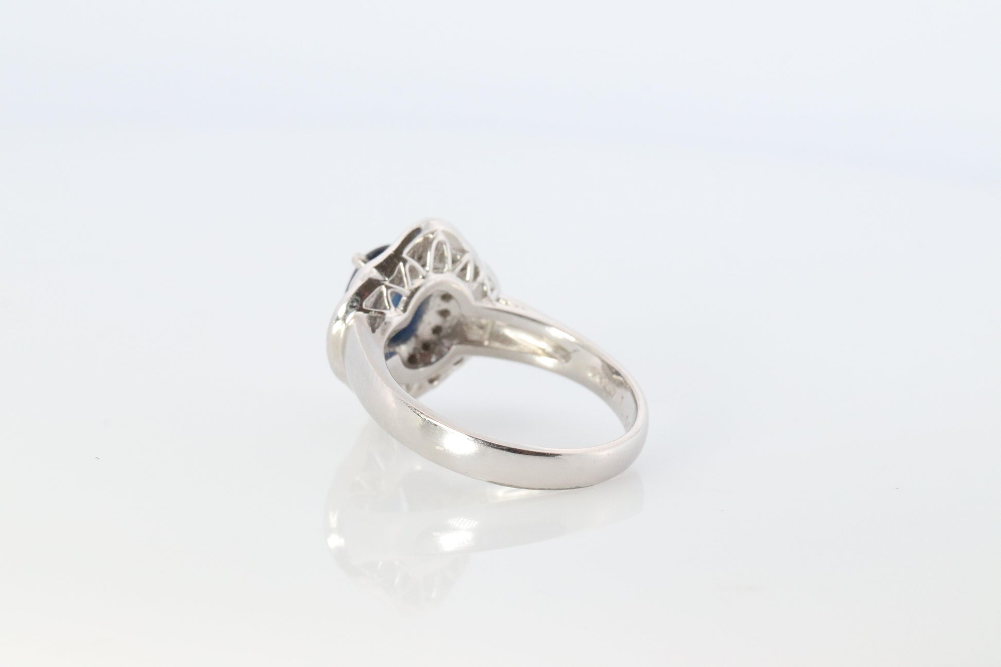 Sapphire and diamond Ballerina ring. Platinum Blue natural sapphire HALO ring