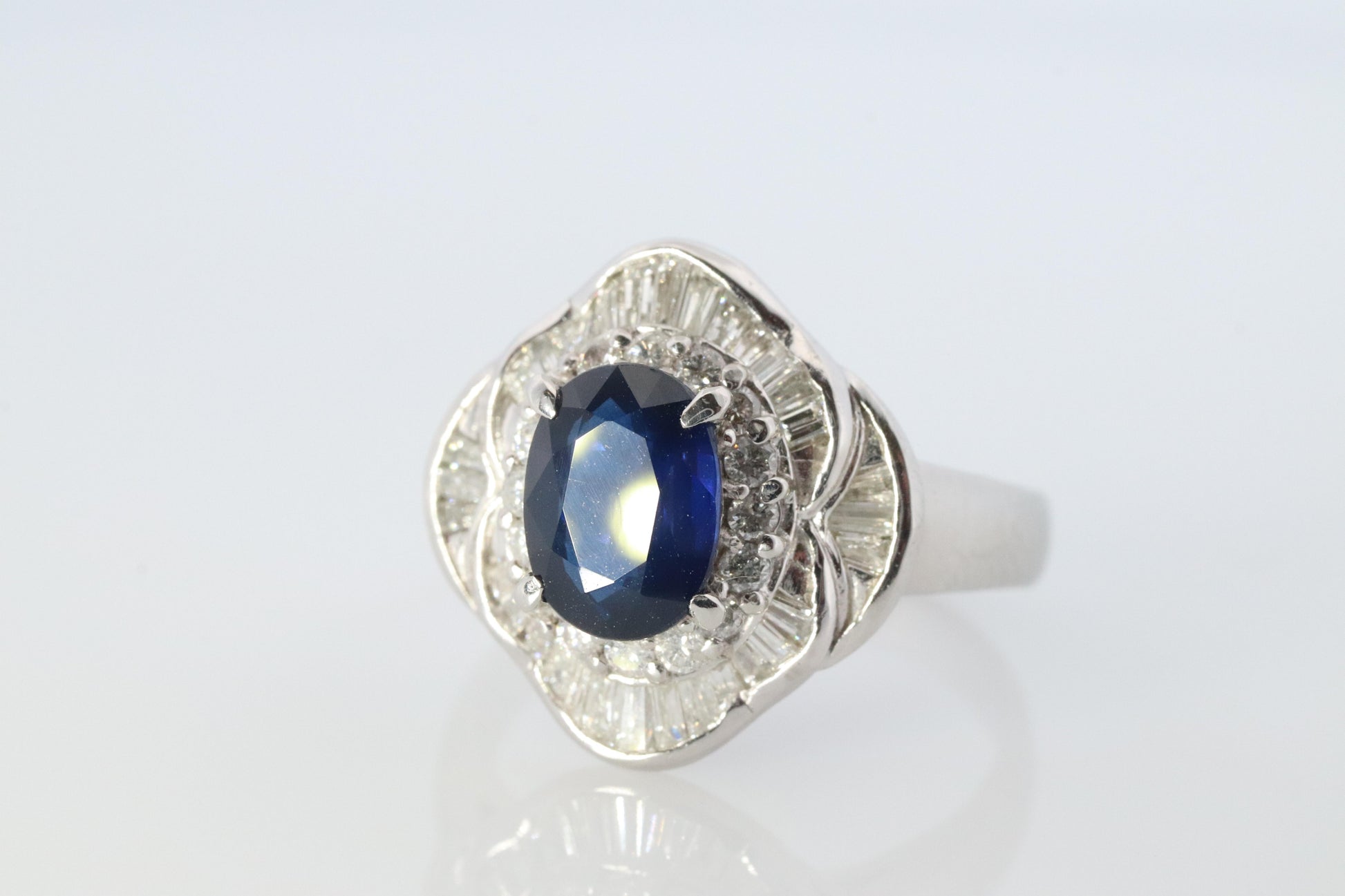 Sapphire and diamond Ballerina ring. Platinum Blue natural sapphire HALO ring