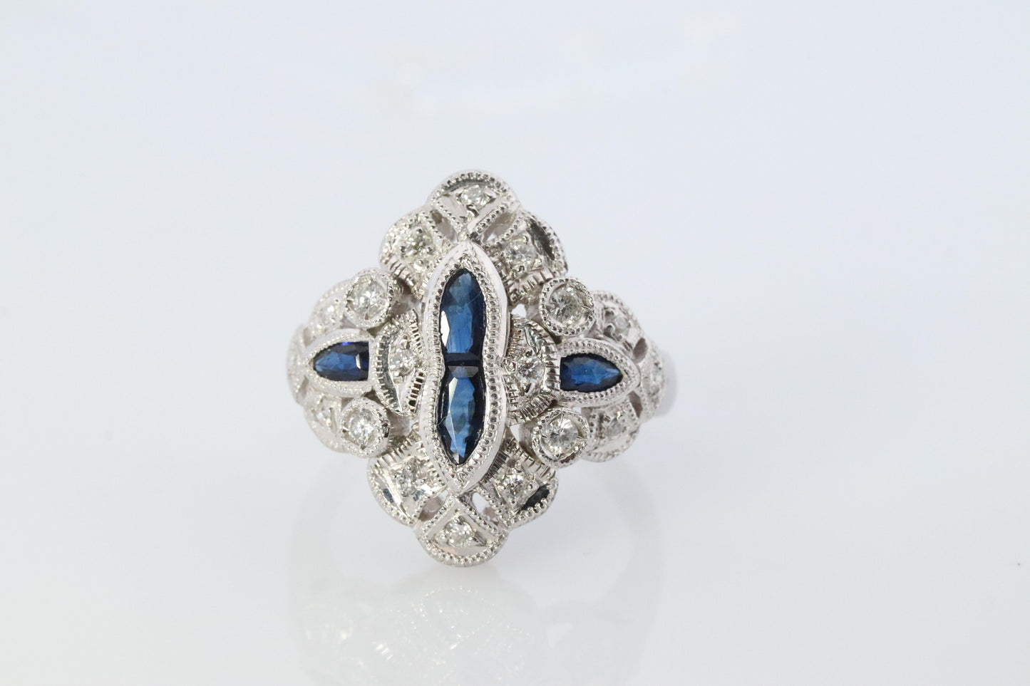Sapphire shield ring. Platinum Shield Ring. Sapphire and Diamond wide band.