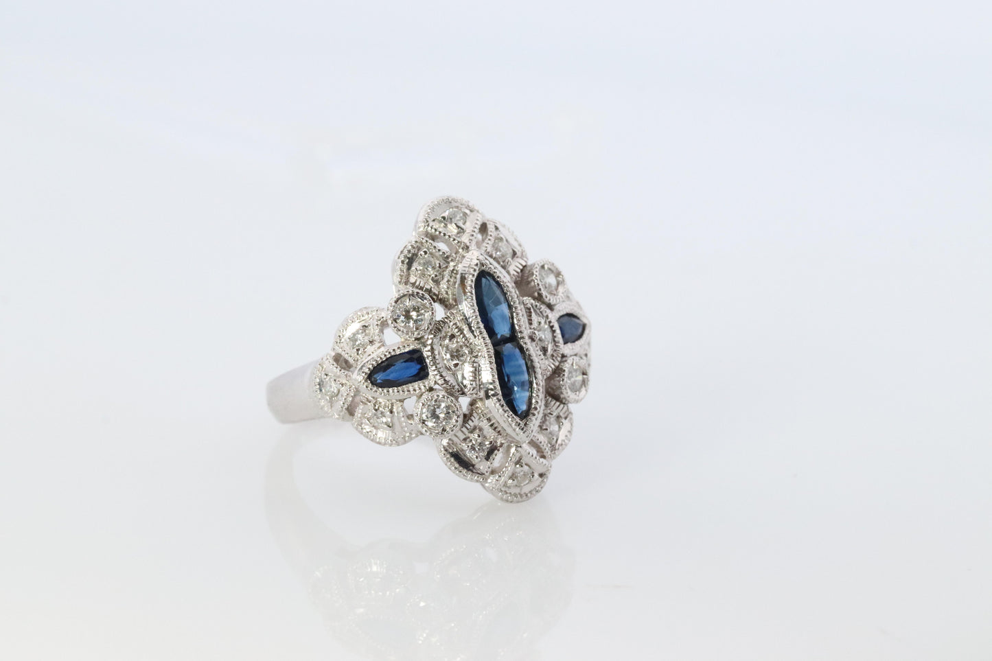 Sapphire shield ring. Platinum Shield Ring. Sapphire and Diamond wide band.