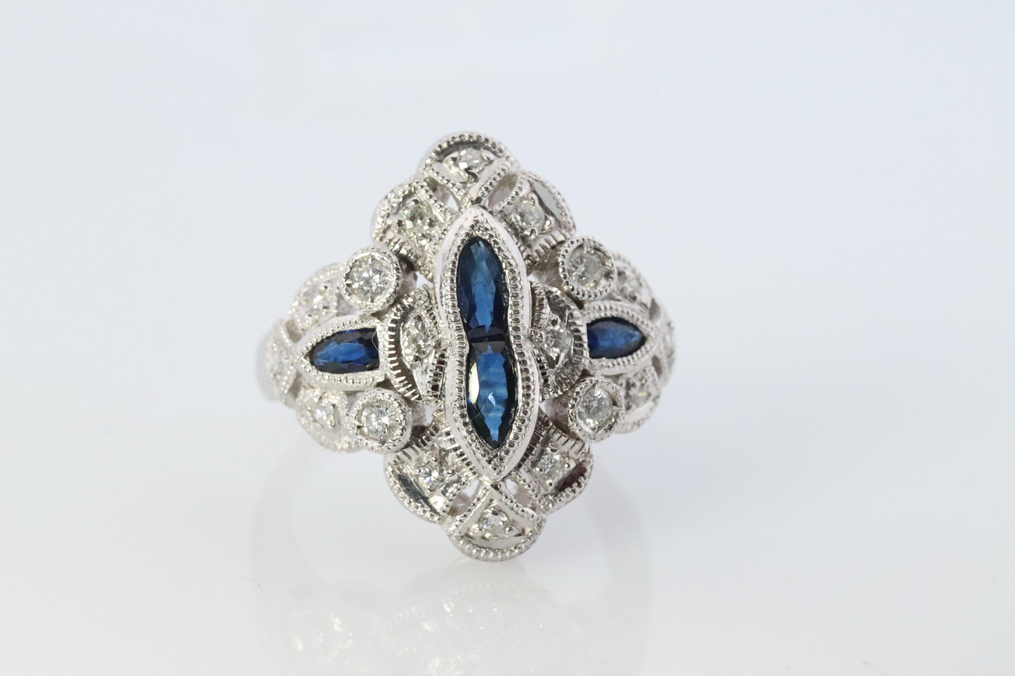 Sapphire shield ring. Platinum Shield Ring. Sapphire and Diamond wide band.