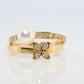Mikimoto Ring. Vintage 18k Gold Mikimoto Pearl Diamond flower bypass ring