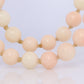 14k Coral Carved Angel Skin Salmon Bead Necklace. Two Strand Peach White Coral