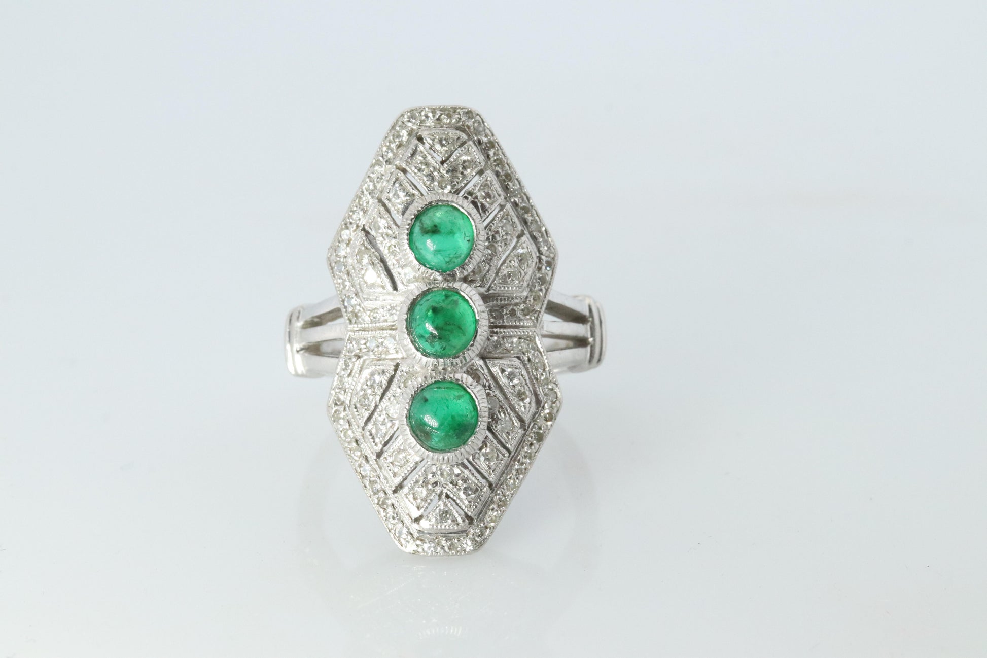Emerald shield ring. Platinum Shield Ring Emerald Cabochon and Diamond wide band