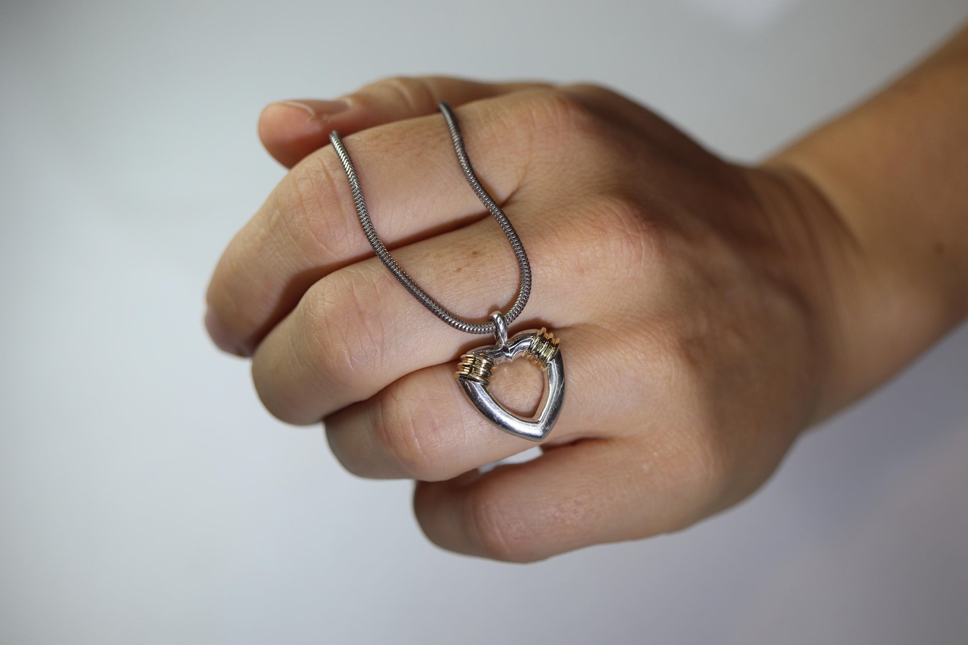 Tiffany and Co Open Heart Pendant. 18k and Sterling Silver