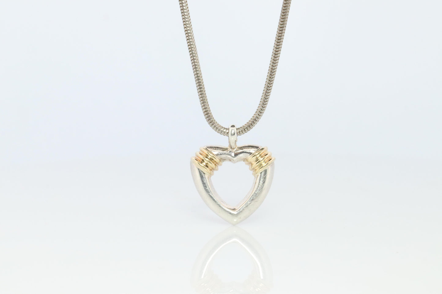 Tiffany and Co Open Heart Pendant. 18k and Sterling Silver
