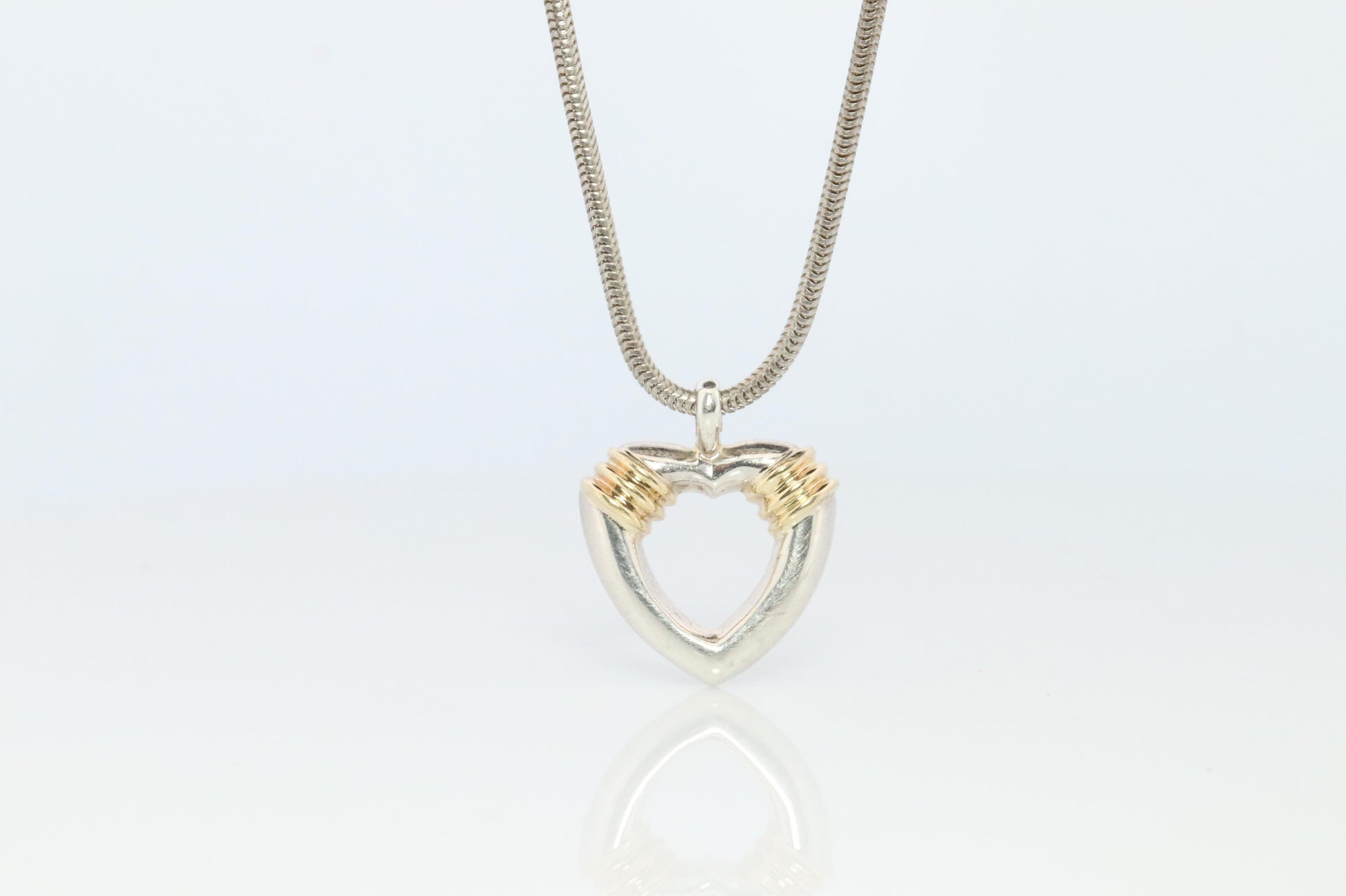 Tiffany and Co Open Heart Pendant. 18k and Sterling Silver