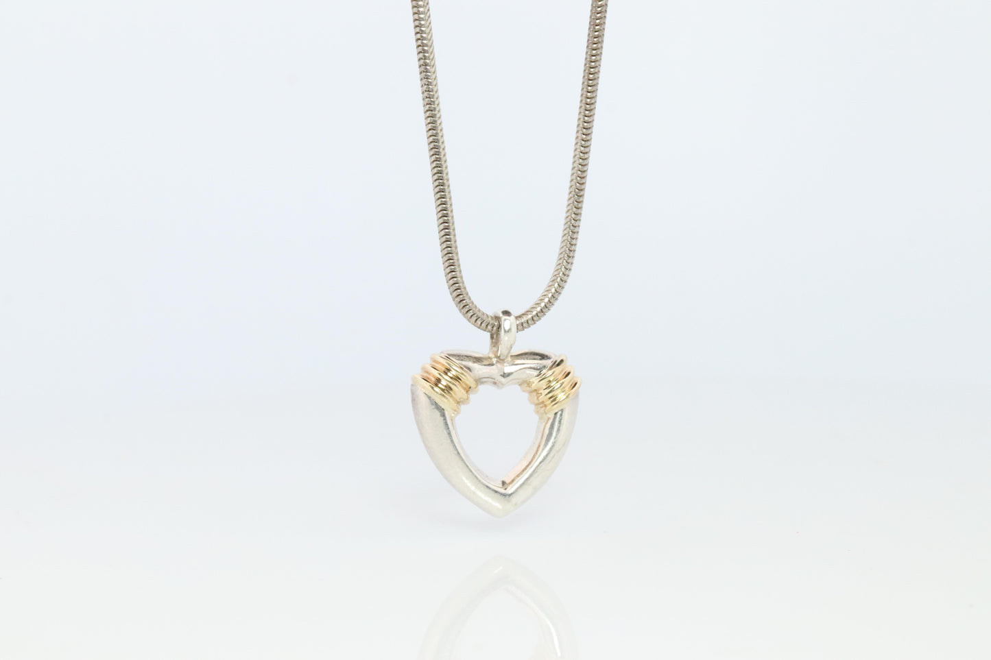 Tiffany and Co Open Heart Pendant. 18k and Sterling Silver
