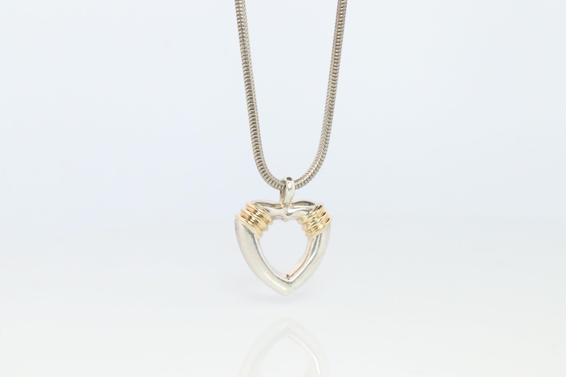 Tiffany and Co Open Heart Pendant. 18k and Sterling Silver