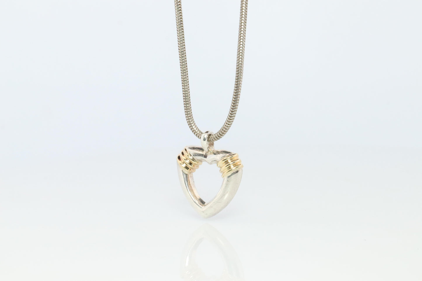 Tiffany and Co Open Heart Pendant. 18k and Sterling Silver