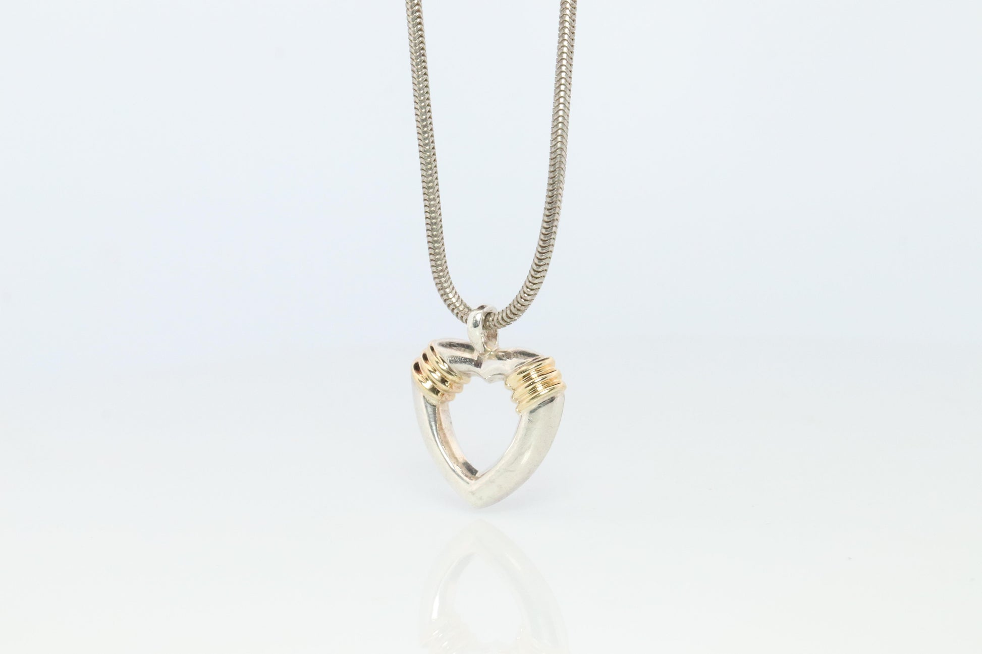 Tiffany and Co Open Heart Pendant. 18k and Sterling Silver