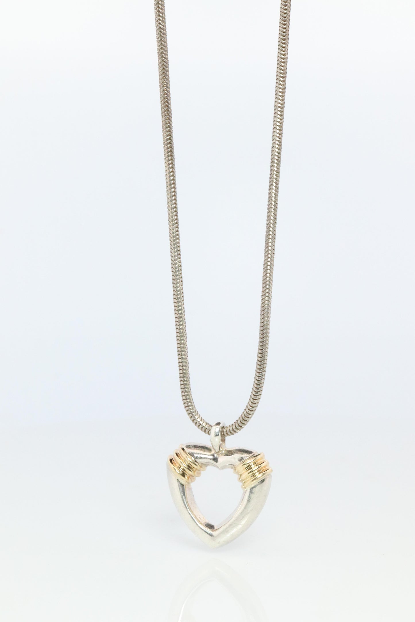Tiffany and Co Open Heart Pendant. 18k and Sterling Silver