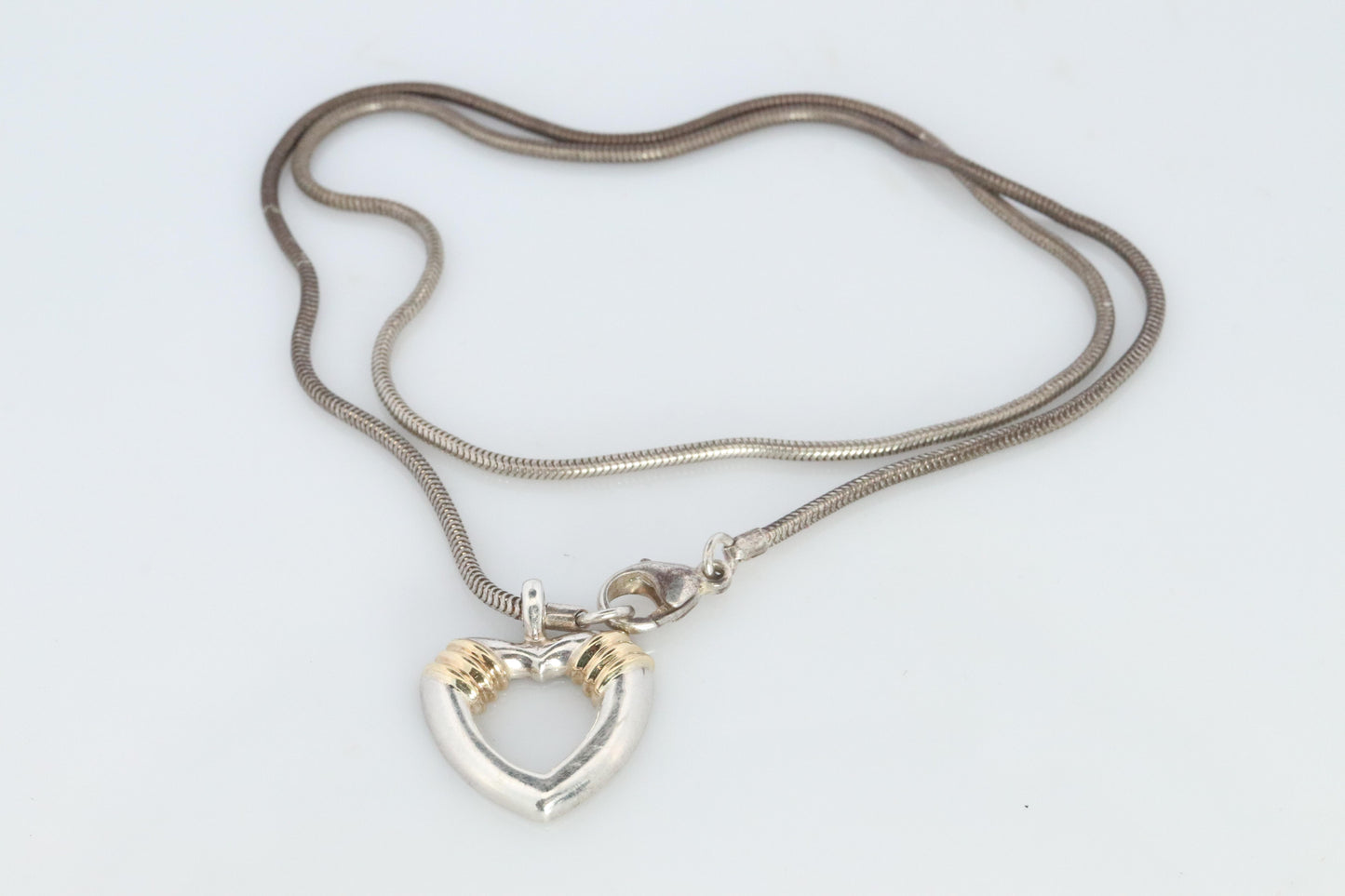 Tiffany and Co Open Heart Pendant. 18k and Sterling Silver