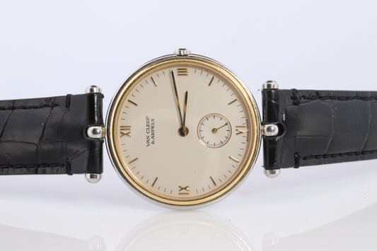 Van Cleef and Arpels 415 104 watch. La Collection 18k SS Round 32mm Watch