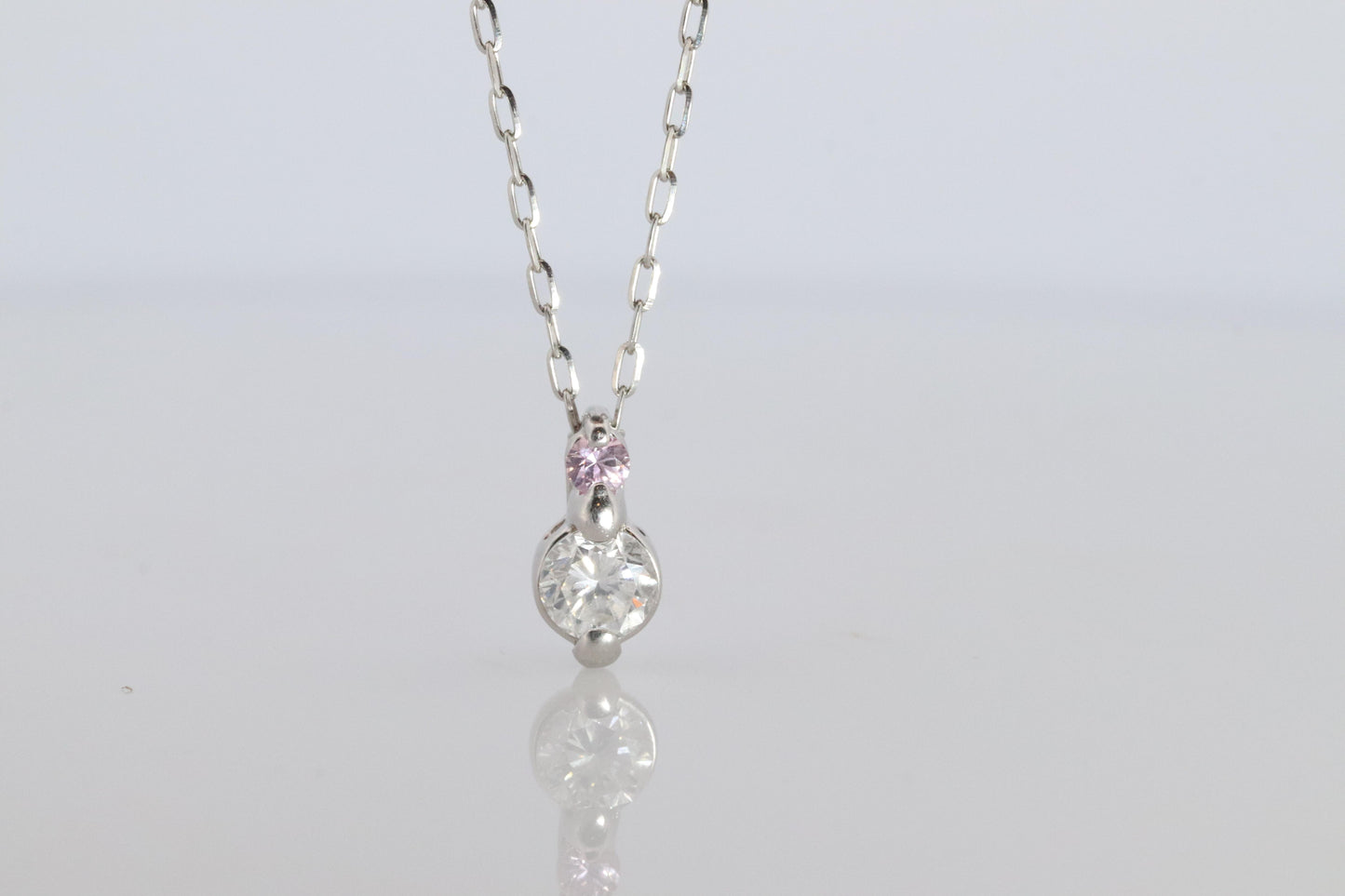 Large PT900 Diamond and Pink accent Pendant. Platinum Pt900 rolo necklace.