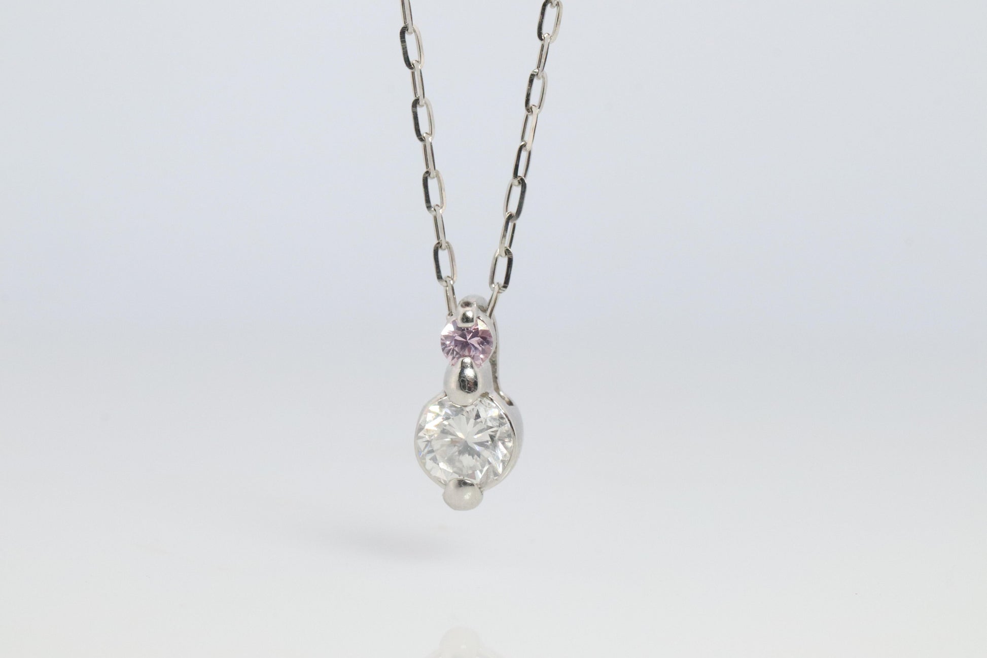 Large PT900 Diamond and Pink accent Pendant. Platinum Pt900 rolo necklace.
