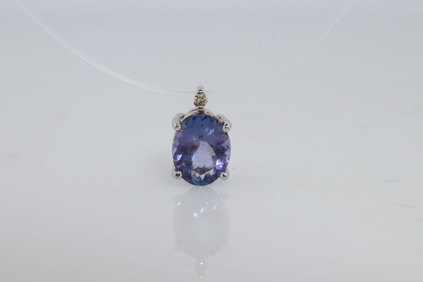 Tanzanite and diamond Pendant. PT850 Platinum Dainty Oval Tanzanite Solitaire