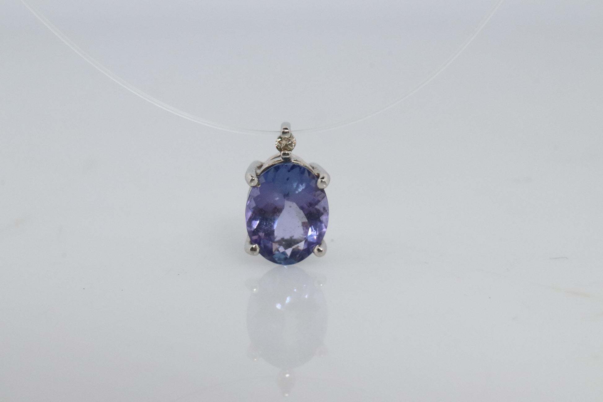 Tanzanite and diamond Pendant. PT850 Platinum Dainty Oval Tanzanite Solitaire