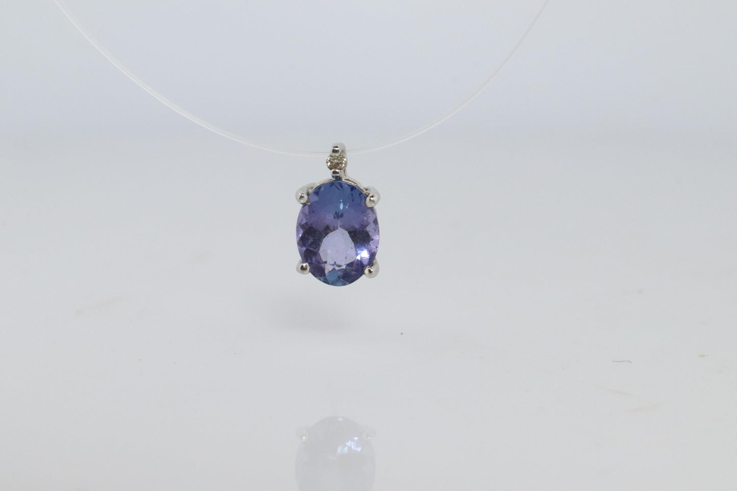 Tanzanite and diamond Pendant. PT850 Platinum Dainty Oval Tanzanite Solitaire